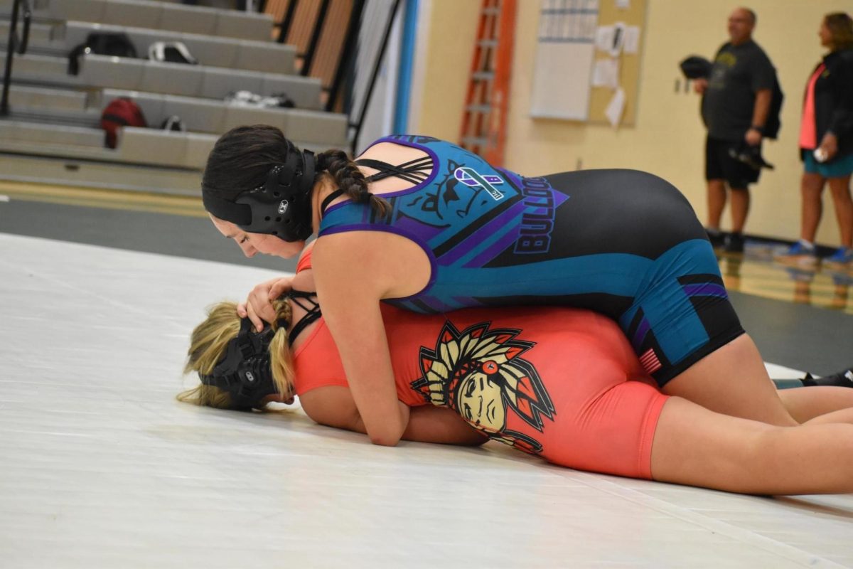 Freshmen Gwen Troth wrestling.